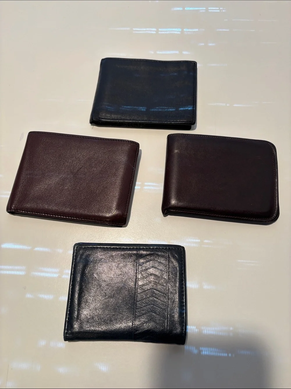 Four Vintage Black and Brown Leather Men's Wallets